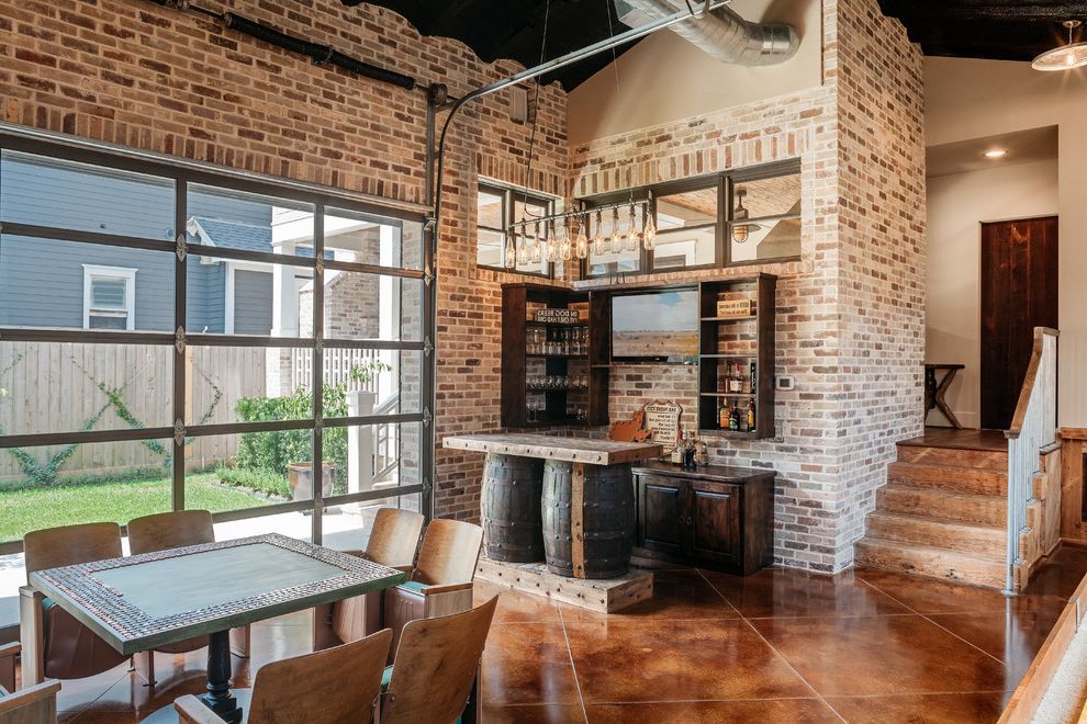 Poteau Theater with Rustic Home Bar Also Brick Wall Brown Floor Tile Exposed Ducts Glass Garage Door Industrial Modern Open Shelving Penny Mosaic Rustic Rustic Wood Theater Chairs Vaulted Ceiling Wine Barrel Kitchen Island