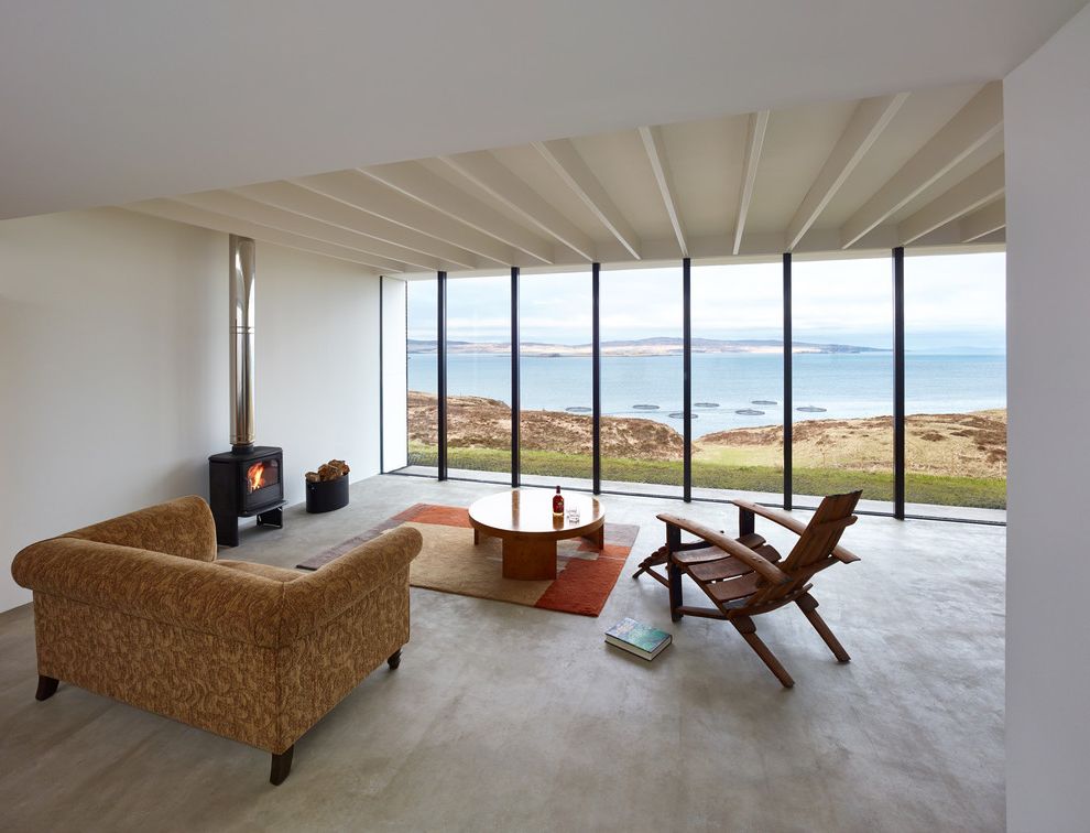 Poured Concrete Floors with Modern Living Room Also Architecture Armchair Coffee Table Glass Wall Log Basket Log Burner Log Burning Stove Manser Medal Shortlist 2014 Poured Concrete Poured Concrete Flooring Riba Sea View