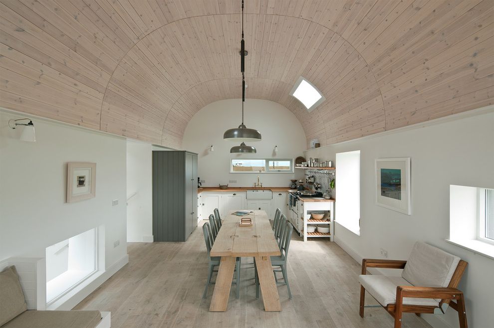 Quonset Hut Kits   Contemporary Dining Room Also Arched Ceiling Asymmetrical Windows Farmhouse Sink Gray Accents Natural Light Natural Wood Table Neutral Palette Pendant Lighting Skylight White Wakks White Washed