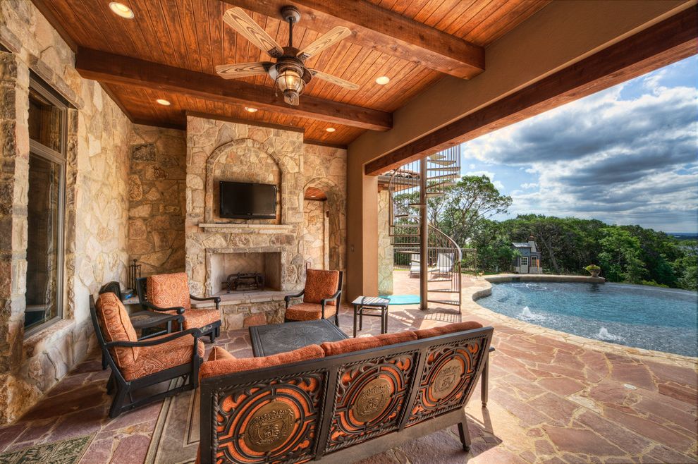 Regina Andrew Furniture   Mediterranean Patio  and Ceiling Ceiling Fan Covered Ceiling Exposed Beams Outdoor Cushions Outdoor Fireplace Outdoor Tv Patio Furniture Patio Pavers Pool Recessed Lighting Tv Above Fireplace Wood Ceiling