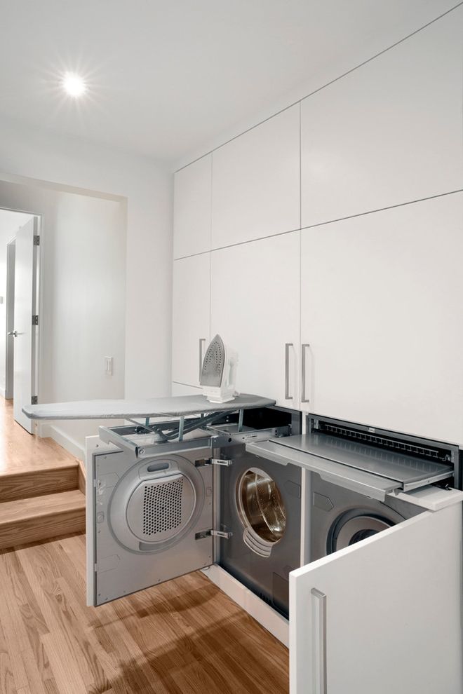 Room and Board Sale   Contemporary Laundry Room  and Built in Cabinets Doorway Hall Hidden Washer and Dryer Ironing Boards Recessed Light Steps White Flat Panel Cabinets White Wall Wood Floor