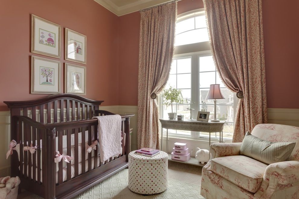 Rooms to Go Cribs with Traditional Nursery and Curtain Tiebacks Curtains Drapes Gallery Wall Girls Room Glider High Ceilings Nursery Pink Walls Storage Cube Toile Wainscoting Wall Art Wall Decor White Wood Window Treatments Wood Molding Wooden Crib