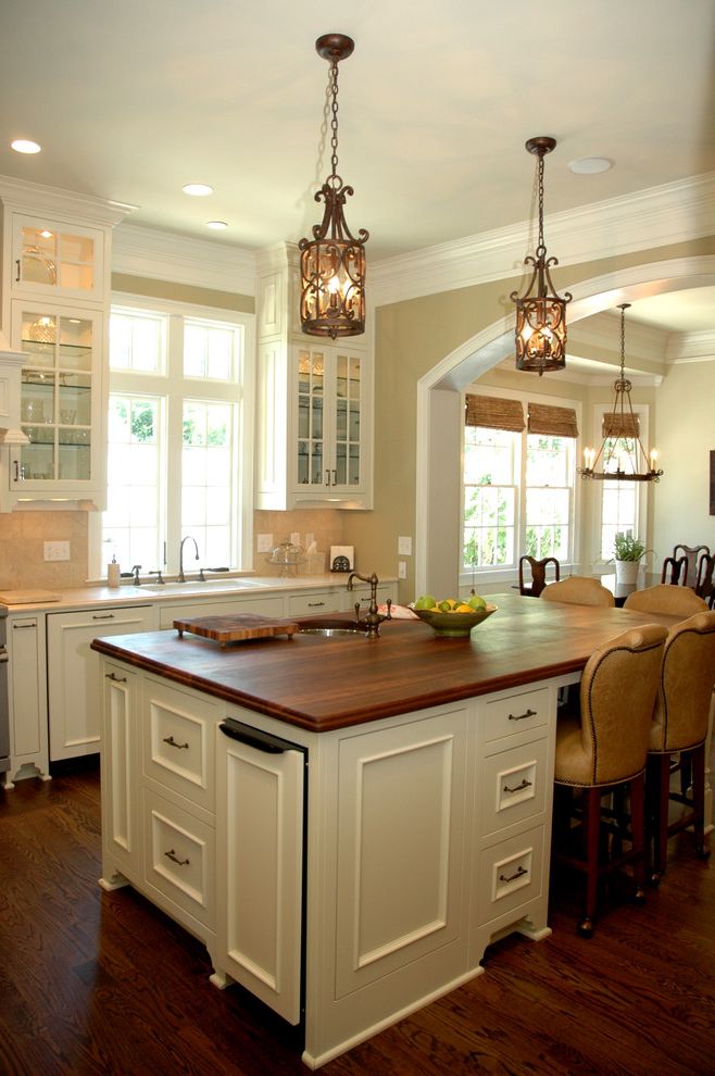 Rubbermaid Garbage Cans with Traditional Kitchen  and Arched Doorway Barstool Chandelier Cottage Farmhouse Kitchen Glass Cabinets Kitchen Island Kitchen Island with Sink Wood Countertop Wood Floor