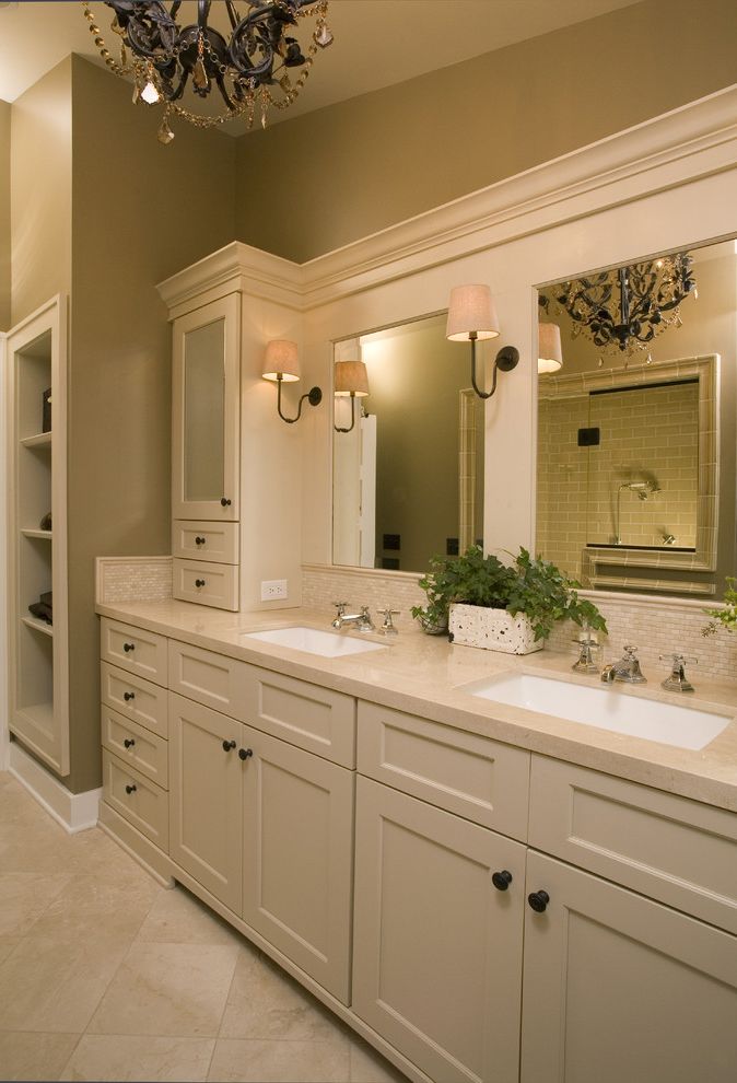 Sconces Definition with Traditional Bathroom  and Bathroom Mirror Bathroom Storage Double Sinks Double Vanity Neutral Colors Sconce Tile Backsplash Tile Flooring Wall Lighting White Wood Wood Trim
