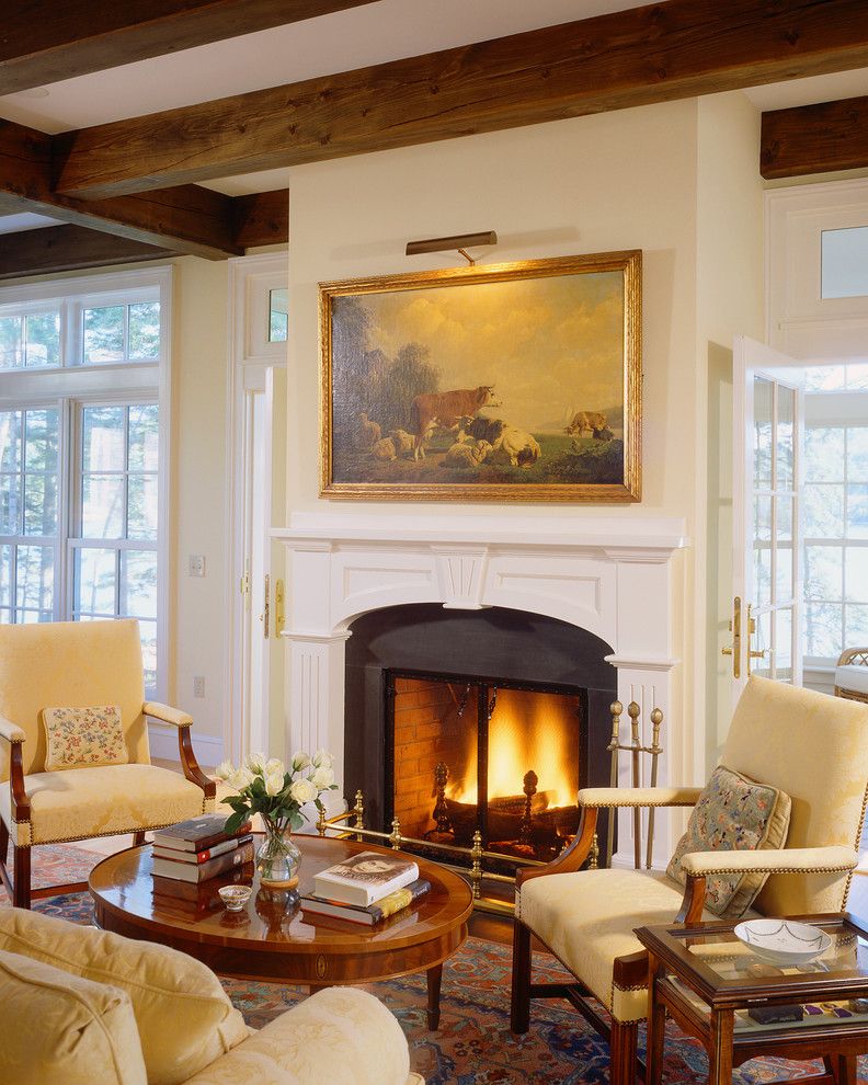 Sea Captains House with Traditional Living Room  and Beamed Ceiling Coastal Home Coastal Maine Home Framed Art Maine New England Style Shingle Style Timber Frame Home Timber Framing Traditional Design Wood Burning Fireplace Wood Fireplace Surround