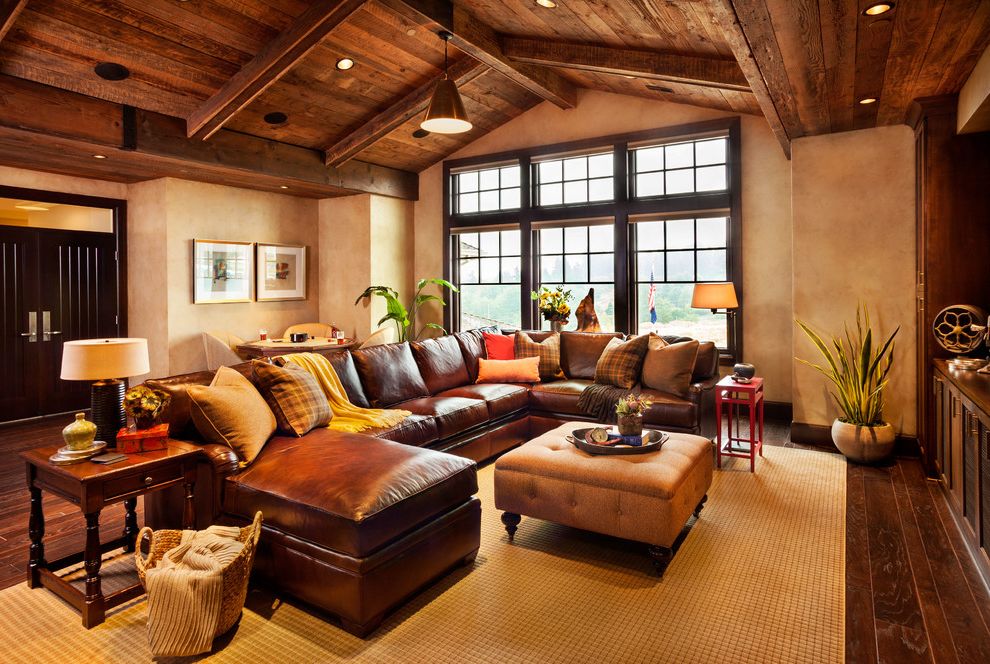Sectional Couches on Sale with Rustic Family Room Also Brown Leather Sofa Brown Sectional Sofa Dark Wood Floor Hardwood Floor Industrial Pendant Leather Sofa Media Room Potted Plat Reclaimed Barnwood Seating Wood Ceiling