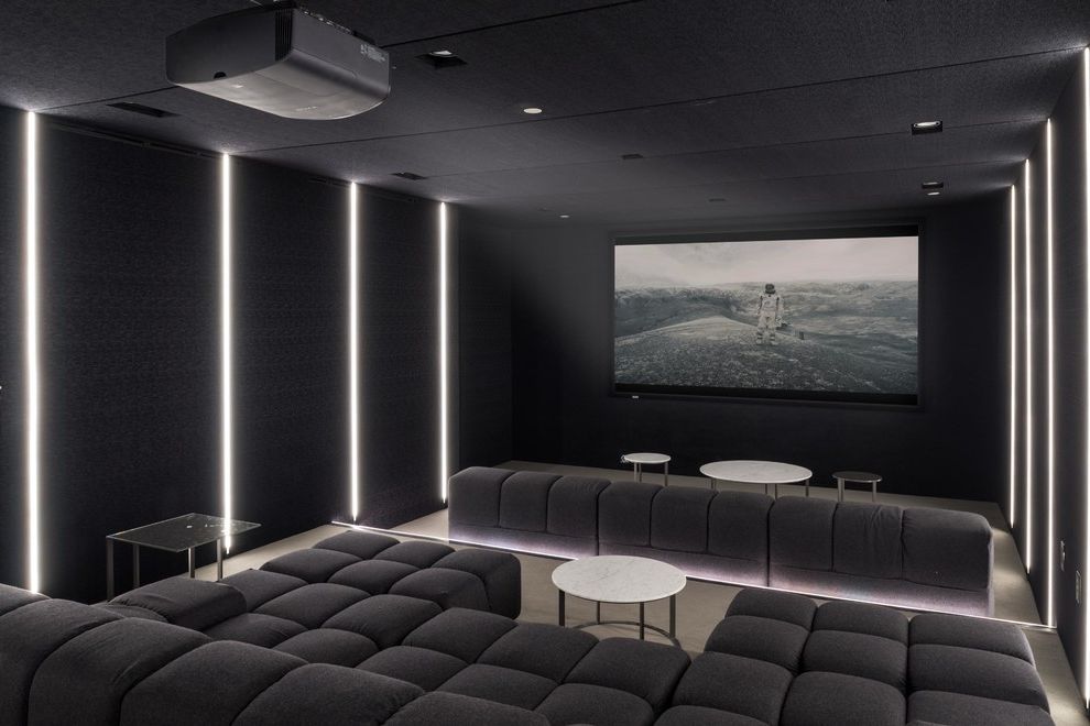 Sierra Vista Theater   Contemporary Home Theater Also Black Walls and Ceiling Dark Gray Sofa Linear Lights Recessed Lighting Round Stone Coffee Table U Shaped Couch