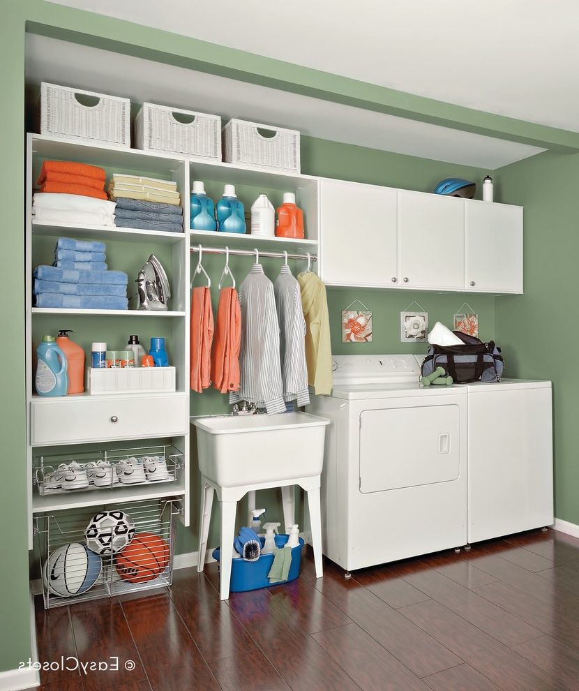 Speed Queen Top Loader with  Laundry Room Also Custom Cabinets Dark Wood Flooring Green Walls Laundry Room Organizer Organized Laundry Room Utility Sink Wire Drawers