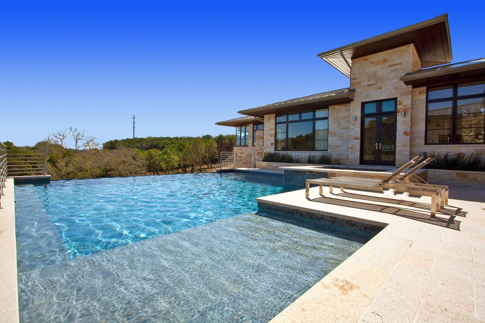 Sun Ray Pools with Contemporary Pool  and French Doors Infinity Edge Lounge Chairs Metal Railing Patio Pool Stone
