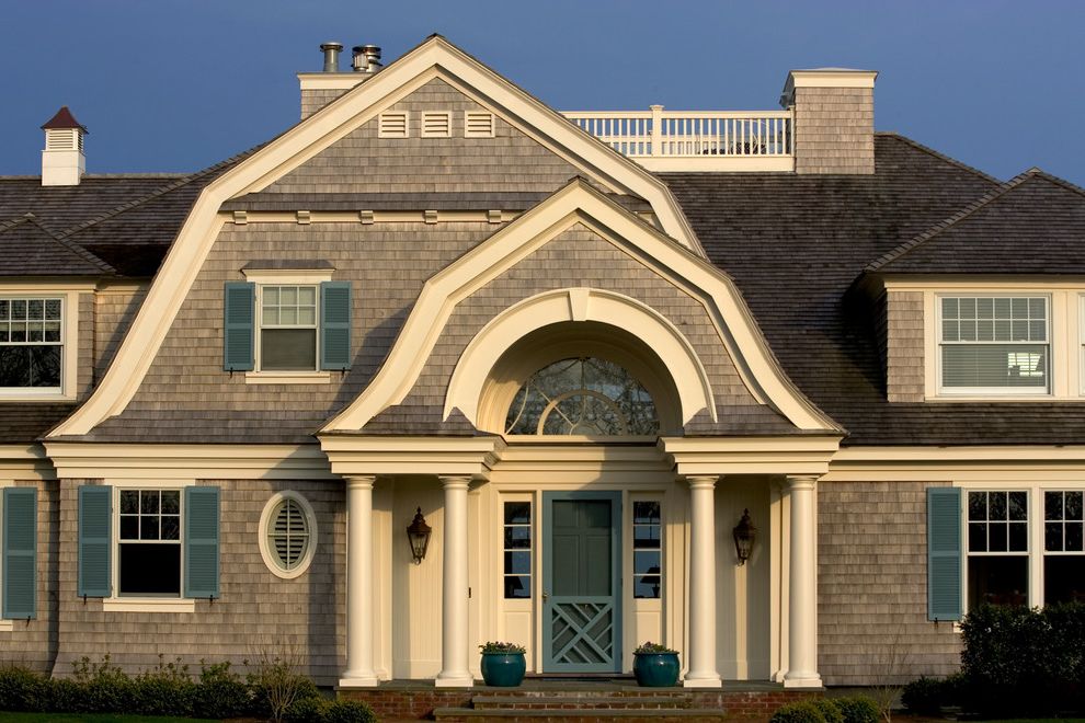 Teal Shutters with Victorian Exterior  and Arched Doorway Blue Cedar Shakes Cedar Shingles Columns Deck Eyebrow Window Gambrel Gray Gray Shingles Light Brown Oval Window Patio Porch White White Trim