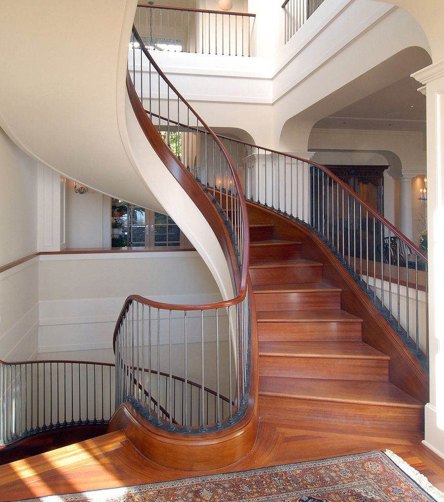 Thin Sheetrock   Traditional Staircase  and Crown Molding Crown Moulding Curved Curved Staircase Foyer Hardwood Floors Metal Spindles Oriental Rug Staircase Wood Handrail