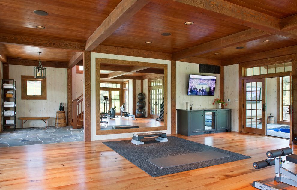 Wood Frame Full Length Mirror with Farmhouse Home Gym  and Exposed Beams French Doors Full Length Mirror Lanterns Mirrored Wall Rustic Stained Wood Ceiling Stone Floors Wood Ceiling Wood Floors Yoga Studio