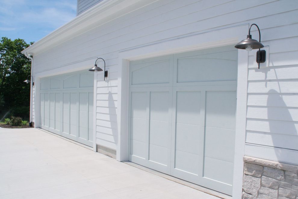 How to Fix a Garage Door Spring with Eclectic Garage  and Barn Lamps Blue Doors Blue Garage Doors Driveway Exterior Lap Siding Outdoor Lighting Pottery Barn Lights Stone White Exterior White House Wood Siding