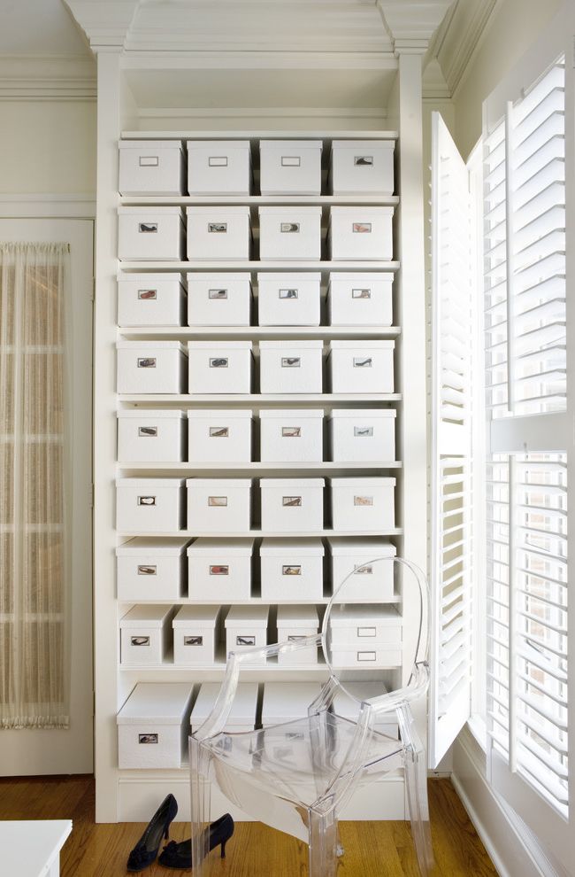 The Container Store Closet Systems   Contemporary Closet  and Beige Molding Beige Trim Beige Wall Clear Armchair Lucite Armchair Natural Lighting Plantation Shutters Sheer Curtains Shoe Boxes Shoe Closet Shoe Storage Stacked Shoe Boxes Wood Floor