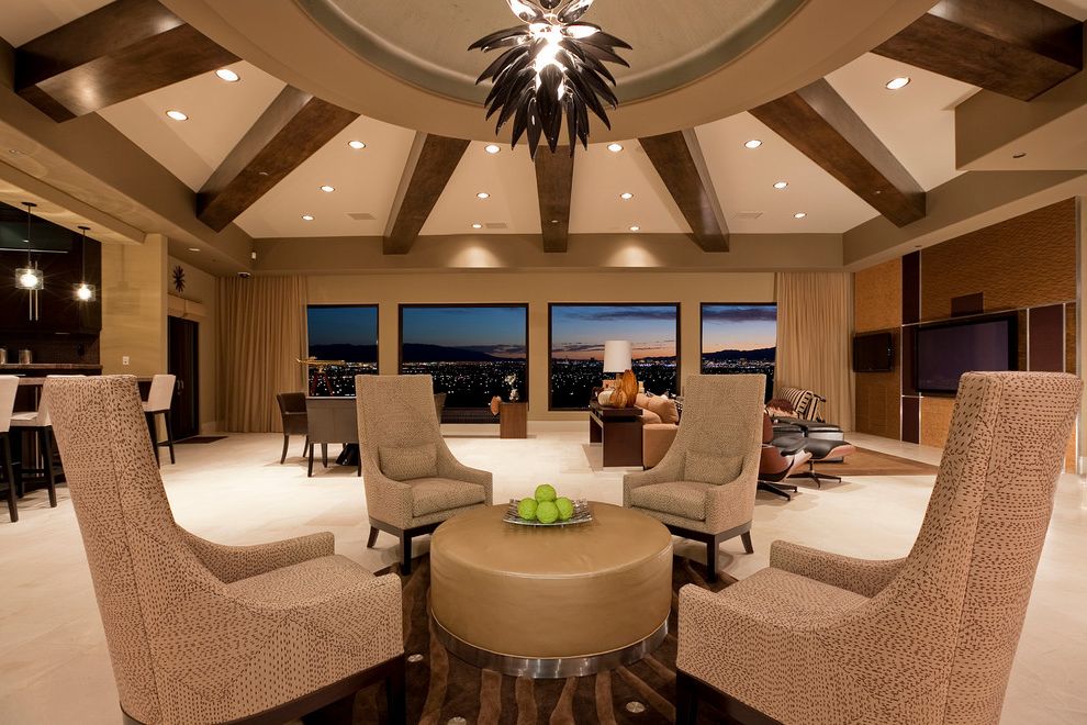 Expanding Circle Table   Contemporary Living Room Also Beige Chairs Brown Rug City View Custom Ceiling Treatment High Ceiling Large Room Large Tv Lumbar Pillows Radial Balance Round Ottoman Round Rug Spiky Light Fixture Warm Neutral Color Scheme