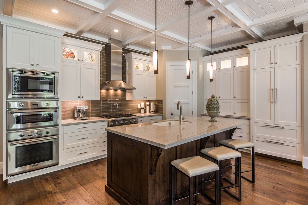 Foremost Homes   Rustic Kitchen Also Beige Countertops Coffered Ceiling Dark Kitchen Island Double Ovens Glass Cabinets Leather Cushion Stools Modern Pendant Light Pendant Lighting Shaker Style Taupe Backsplash White Cabinets Wood Floors Wood Stools