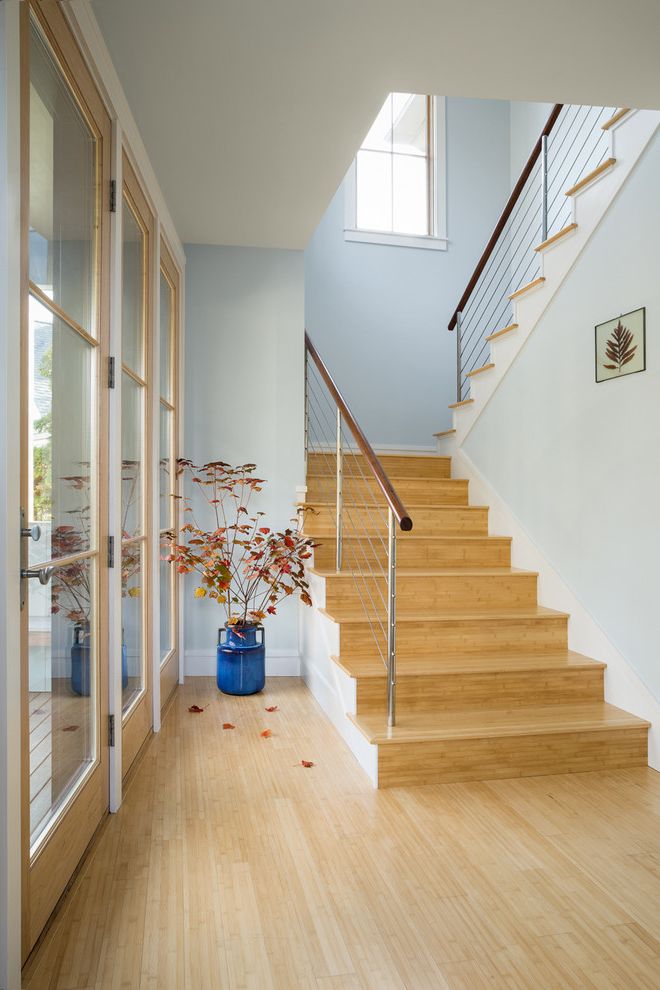 How to Clean Bamboo Floors   Transitional Staircase Also Autumn Leaves Bamboo Floors Cable Rail Cable Railing Custom Home Entry Hall Light Blue Walls Light Wood Floor Light Wood Risers Light Wood Tread Maine Ocean View Seasonal Decor Vacation Home
