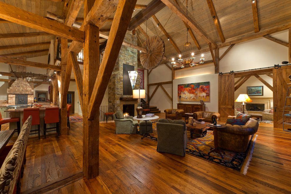 Restore Newington Nh with Traditional Living Room Also Area Rug Armchair Barn Doors Beams Chesterfield Sofa Hardwood Floor High Ceiling Kitchen Island Open Plan Renovated Barn Sculpture Sliding Doors Stone Fireplace Timbers Truss