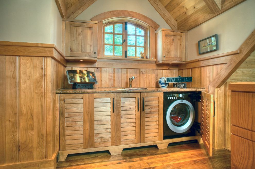 Lowes Ozark Mo with Traditional Laundry Room  and Alder Arched Window Black Appliances Black Dryer Hidden Laundry Laundry Sink Louver Door Louvered Cabinets Vaulted Ceiling Wainscoting Washer Wood Cabinets