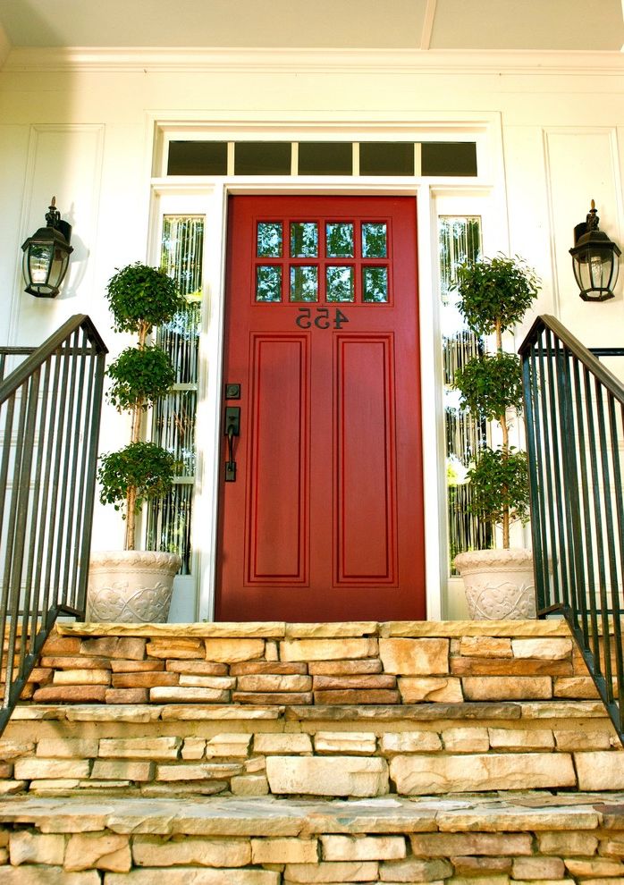 Lowes Monroe La   Traditional Entry  and Front Door Front Entrance House Number Iron Railing Numbers on Door Outdoor Lantern Lighting Potted Plants Red Front Door Stone Patio Stone Steps Topiaries Wrought Iron Hardware